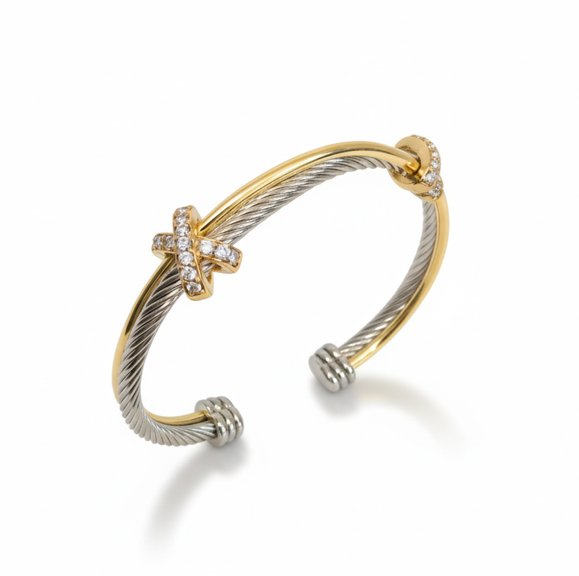Two-toned gold and silver bracelet on a white background