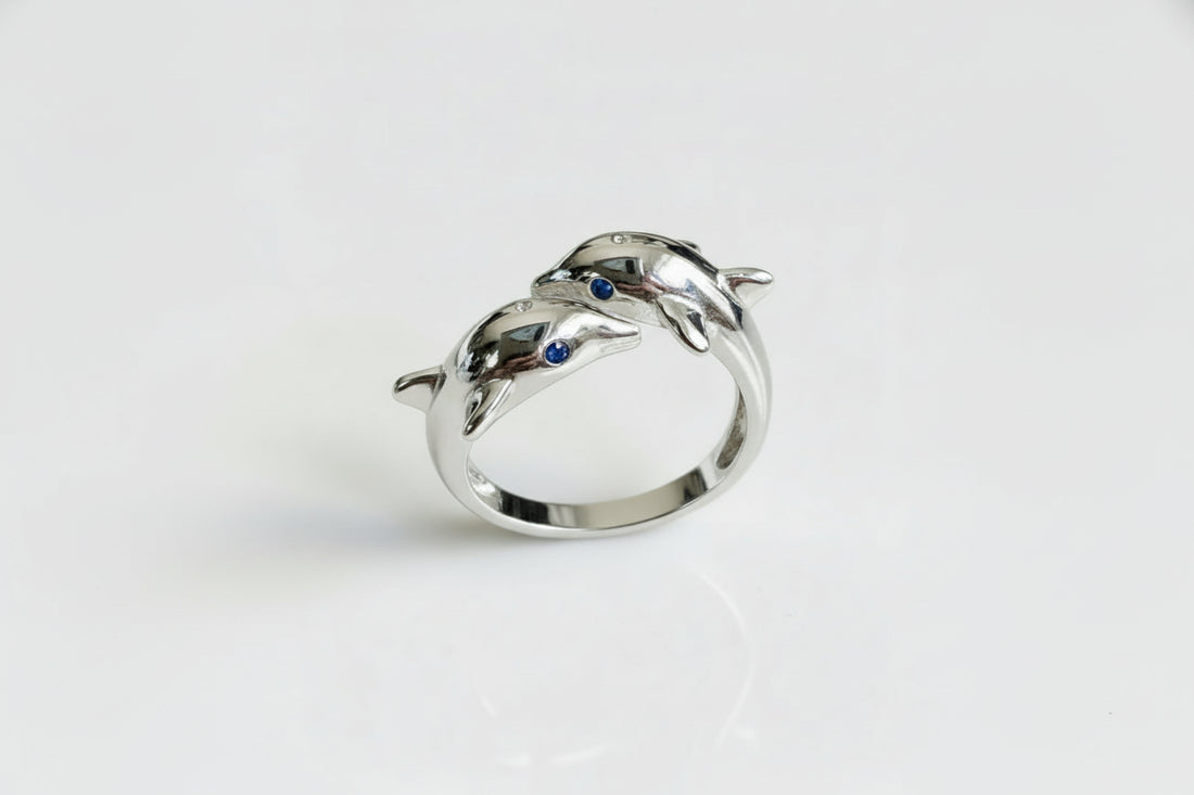 Silver dolphin ring with blue gemstones 