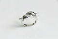 Silver dolphin ring with blue gemstones 