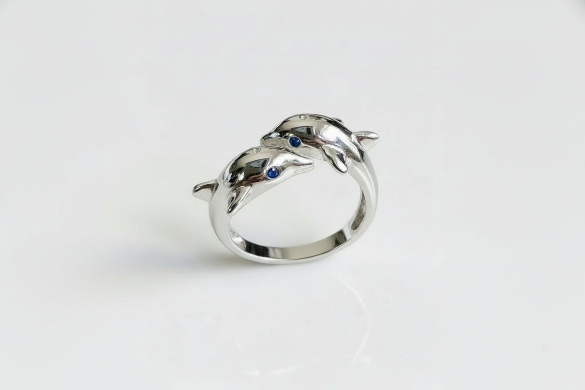 Silver dolphin ring with blue gemstones 